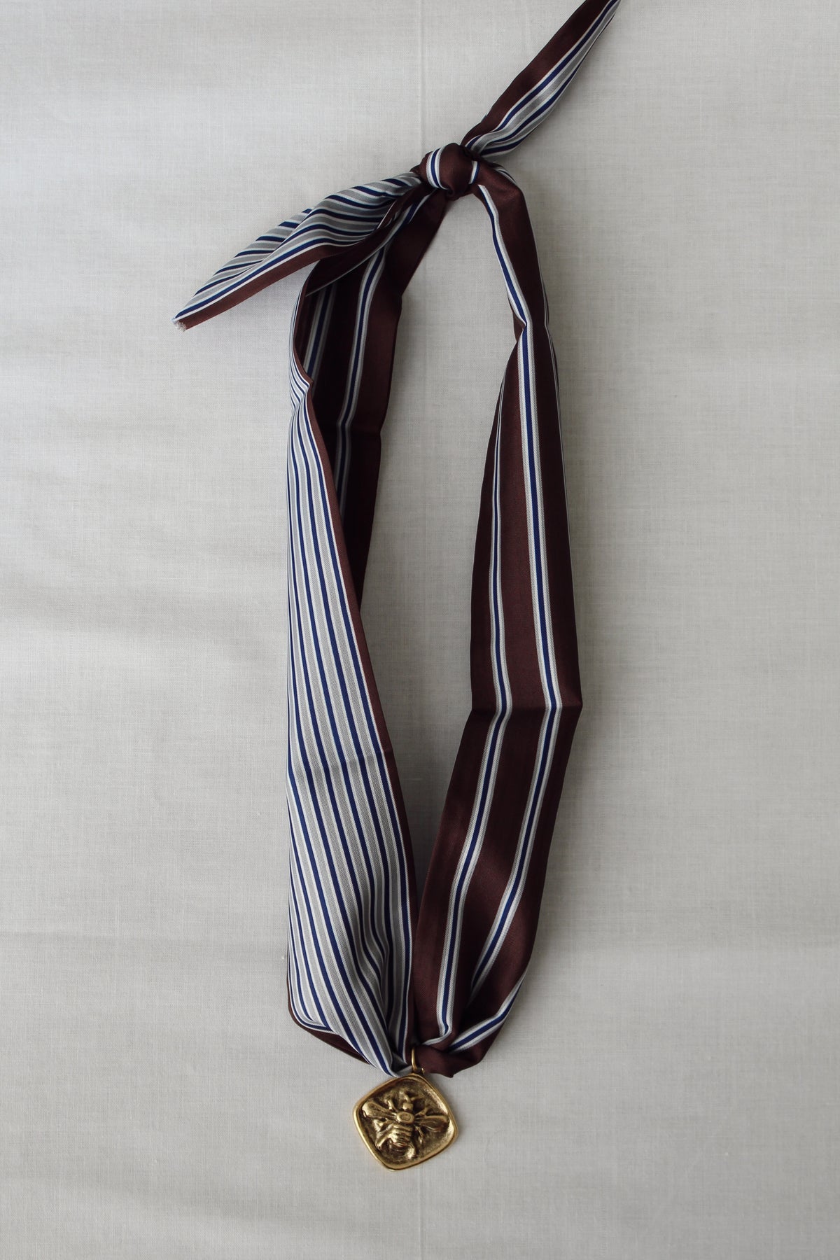 Chocolate brown, navy, white and grey striped Honeybee Scarf Necklace with gold bee pendant