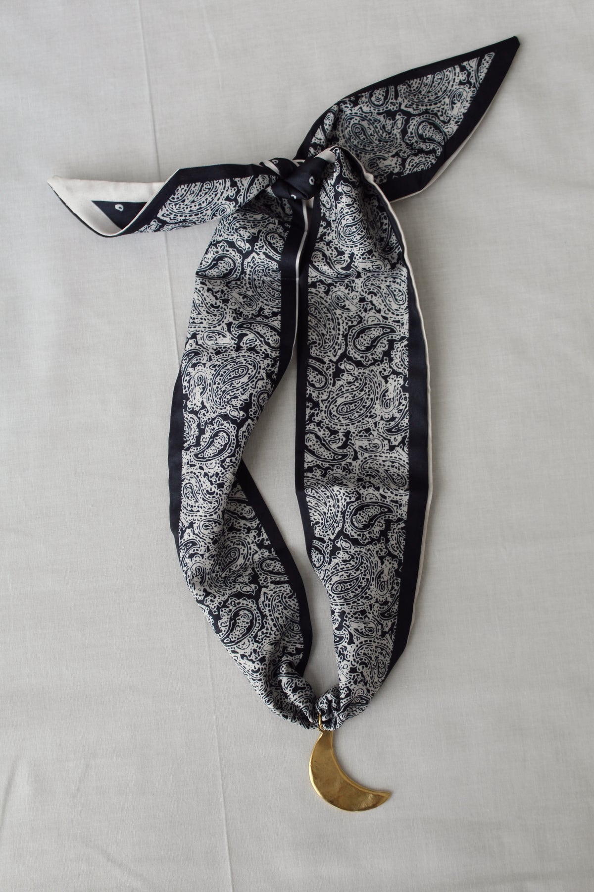 After Dark navy and white paisley scarf necklace with gold crescent moon pendant
